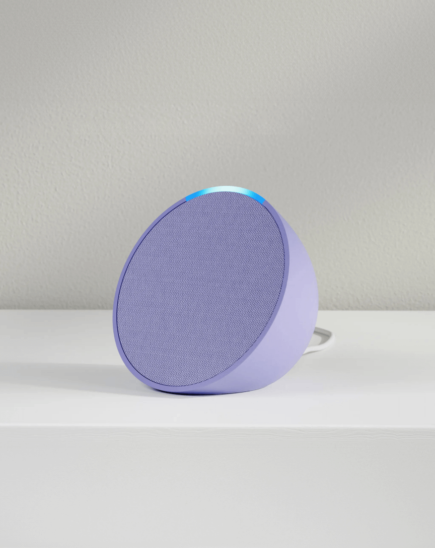 A purple Amazon echo sitting on a counter.